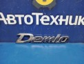 Эмблема задняя Mazda Demio DY3W  2003