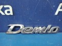 Эмблема задняя Mazda Demio DY3W  2004