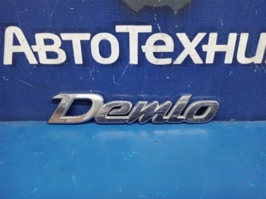 Эмблема задняя Mazda Demio DY3W 2003 